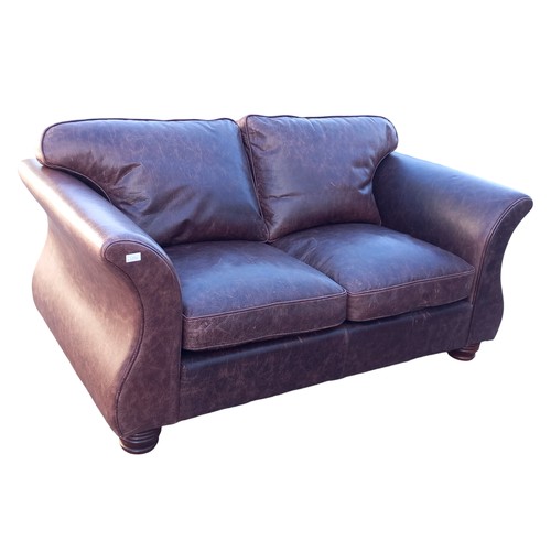 302 - A BROWN LEATHER 2 SEATER SETTEE