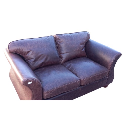 302 - A BROWN LEATHER 2 SEATER SETTEE