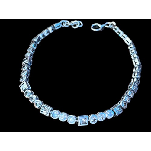 269 - A SILVER AND WHITE CRYSTAL LINE BRACELET WITH A TRIGGER CATCH