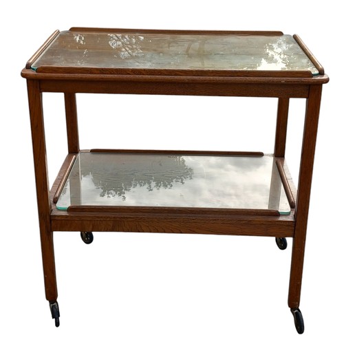 336 - A RETRO 2 TIER OAK TROLLEY WITH FITTED GLASS INSETS