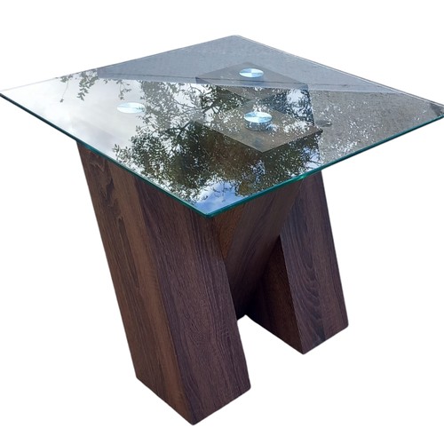 401 - A DESIGNER WALNUT CROSSED FRAMED LAMP TABLE WITH A GLASS TOP