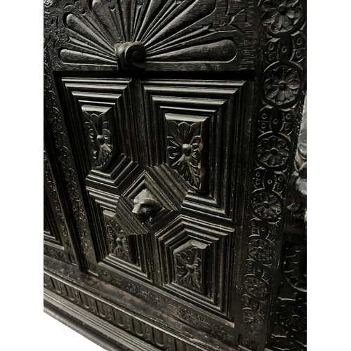 474 - A STUNNING ANTIQUE HEAVILY CARVED TALL IRISH BOOKCASE WITH STAINED GLASS PANELS DECORATIVLY CARVED W... 