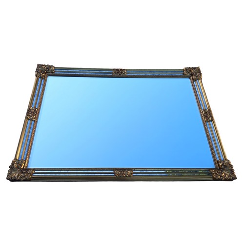 476 - AN ORNATE GILT FRAMED MIRROR