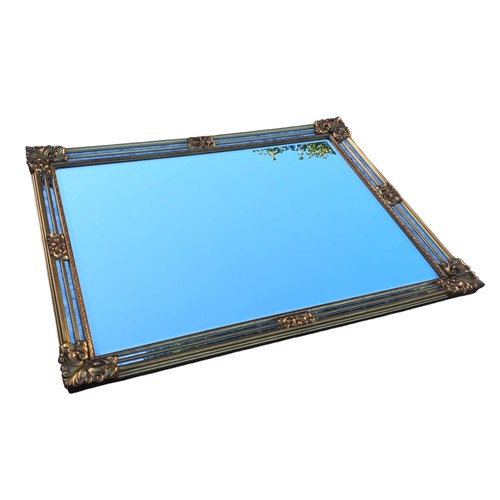 476 - AN ORNATE GILT FRAMED MIRROR