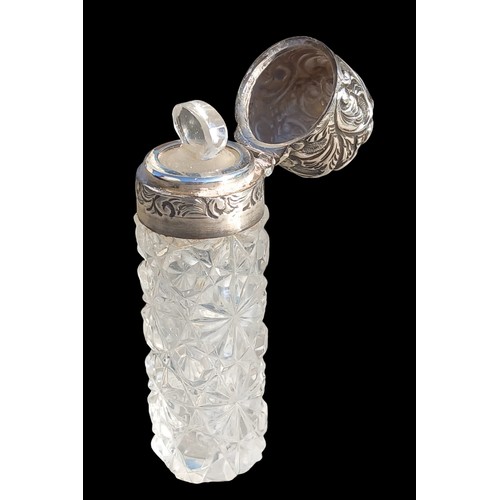 493 - A CUT GLASS PERFUME BOYYLE WITH GLASS STOPPER AND BIRMINGHAM SILVER TOP