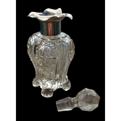 509 - A BIRMINGHAM SILVER TOPPED CUT GLASS BOTTLE DATED 1900