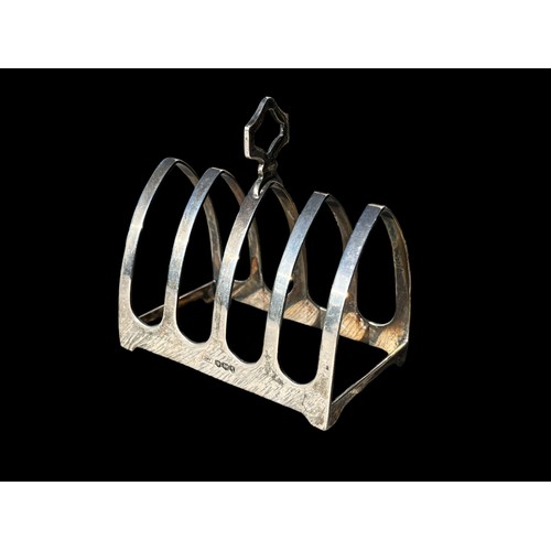 517 - A SHEFFIELD SILVER NEAT SIZED TOAST RACK