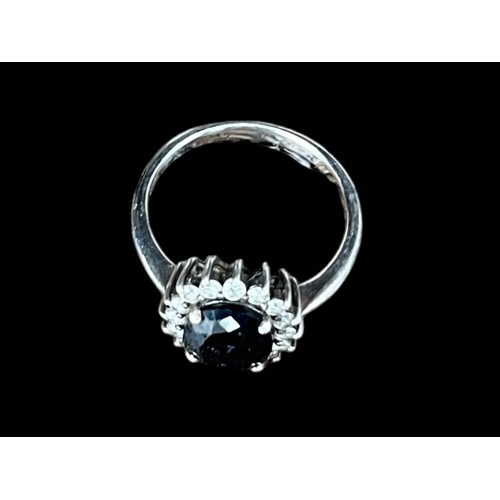 533 - A SILVER RING WITH SAPPHIRE AND CZ