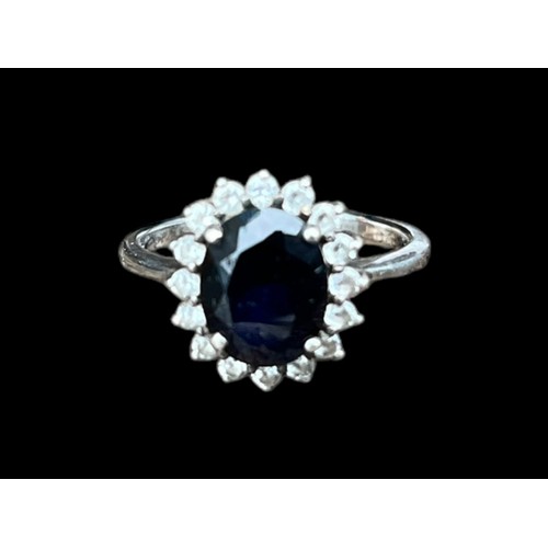 533 - A SILVER RING WITH SAPPHIRE AND CZ