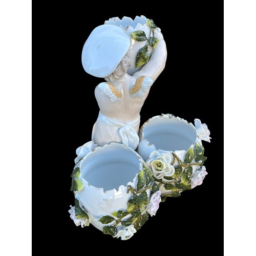 472 - AN ANTIQUE PORCELAIN CENTRE PIECE IN FLORAL PATTERN WITH WINGED FIGURE