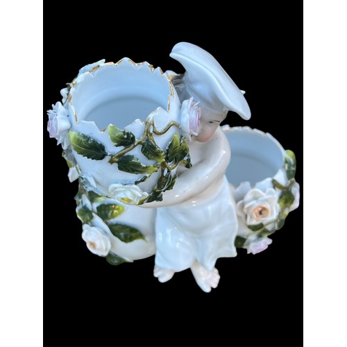 472 - AN ANTIQUE PORCELAIN CENTRE PIECE IN FLORAL PATTERN WITH WINGED FIGURE