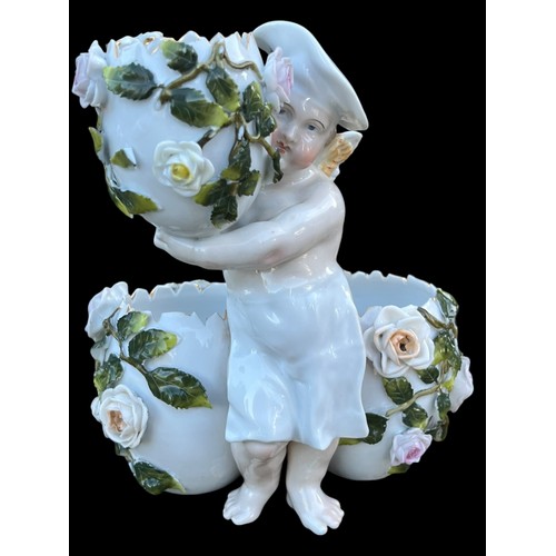 472 - AN ANTIQUE PORCELAIN CENTRE PIECE IN FLORAL PATTERN WITH WINGED FIGURE