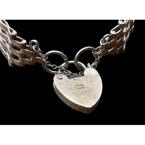 525 - A 4 BAR SILVER GATE BRACELET WITH A SILVER HEART LOCK