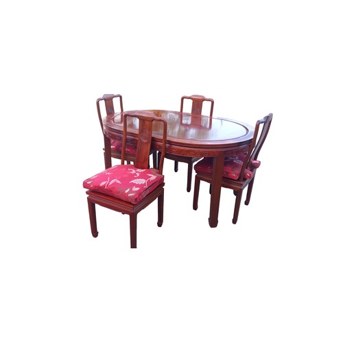 164A - AN ORIENTAL OVAL ROSEWOOD TABLE ND 4 CHAIRS