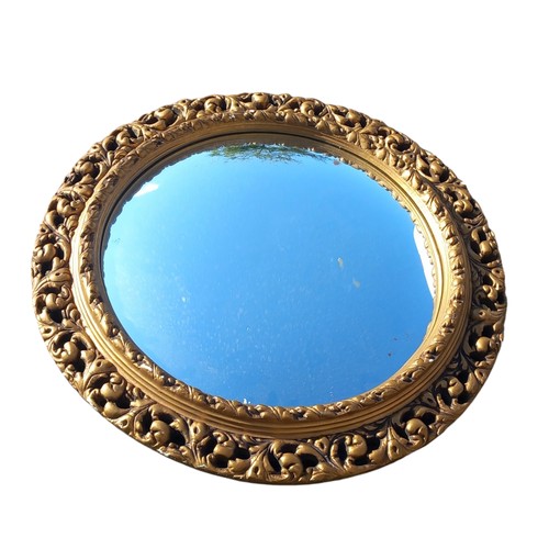 30 - A GILT OVAL MIRROR 21