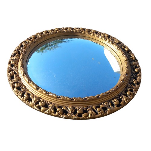 30 - A GILT OVAL MIRROR 21