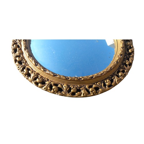 30 - A GILT OVAL MIRROR 21