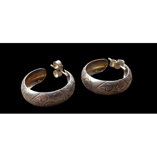 218 - A PAIR OF SILVER HALF HOOP EARRINGS