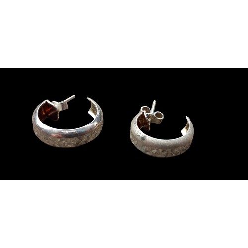 218 - A PAIR OF SILVER HALF HOOP EARRINGS