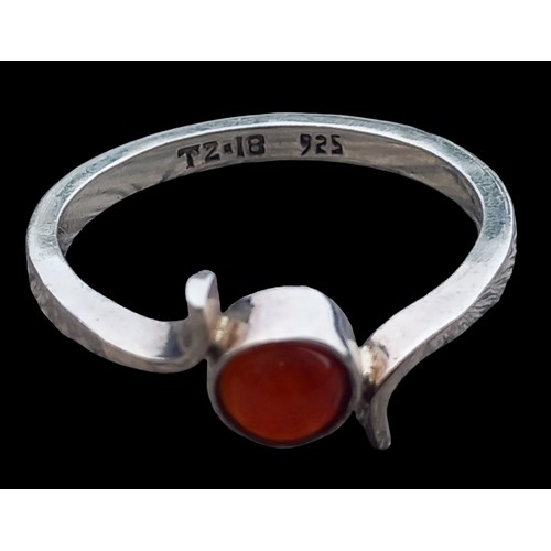 221 - AN AMBER SET SILVER RING