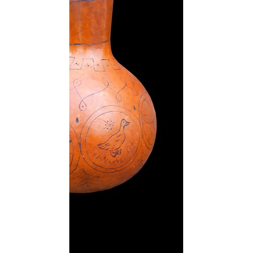 57 - AN AUTHENTIC CARVED AFRICAN CALABASH RATTLE