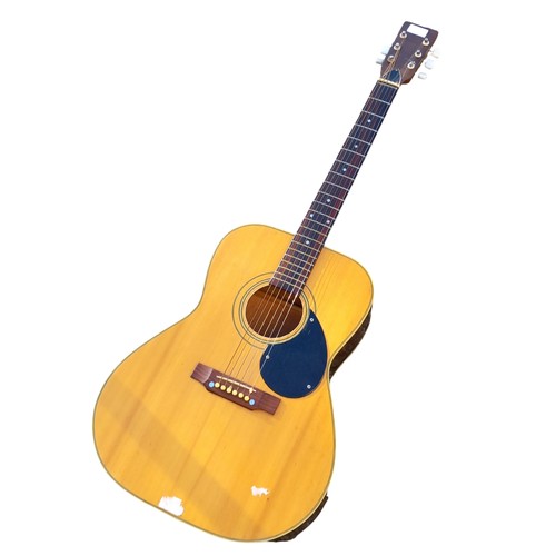 63 - AN ACOUSTIC GUITAR