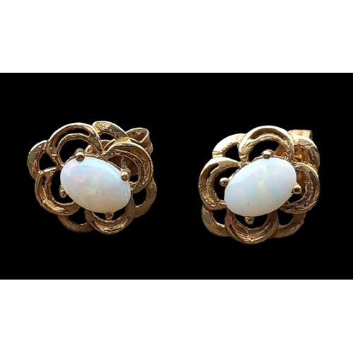 228 - A  PAIR OF 9ct GOLD OPAL SET EARRINGS