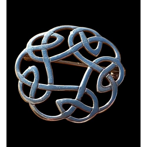 240 - A SILVER CELTIC BROOCH