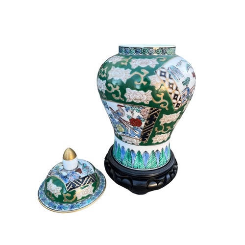 119 - A HAND PAINTED ORIENTAL  TEMPLE JAR ON STAND