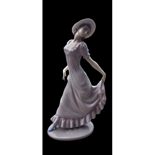 133 - A NAO FIGURENE LADY POSING WITH DRESS LIFTED 31cm TALL