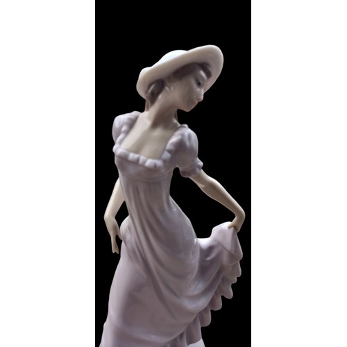 133 - A NAO FIGURENE LADY POSING WITH DRESS LIFTED 31cm TALL