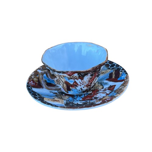 134 - AN ORIENTAL HAND PAINTED CUP AND SAUCER WITH MARKINGS TO THE BASE