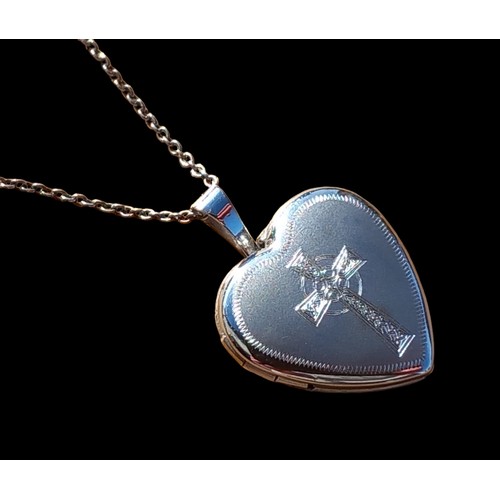 153 - A SILVER SATIN HEART WITH AN ETCHED CROSS ON SILVER CHAIN