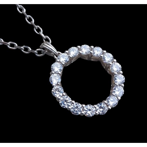 195 - A SILVER GEMSET CIRCULAR PENDANT ON SILVER CHAIN