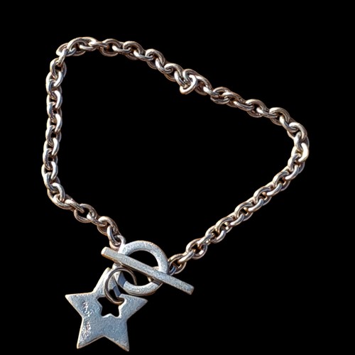 201 - A SILVER BAR BRACELET WITH A SILVER STAR