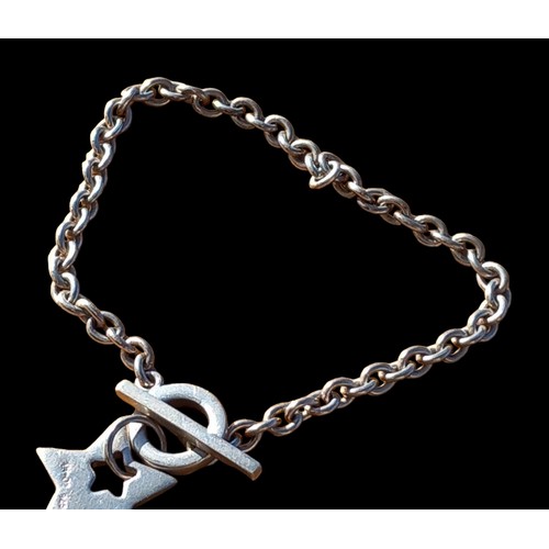 201 - A SILVER BAR BRACELET WITH A SILVER STAR