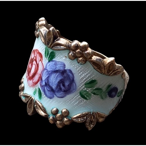 163 - A SILVER AND ENAMEL FLORAL RING