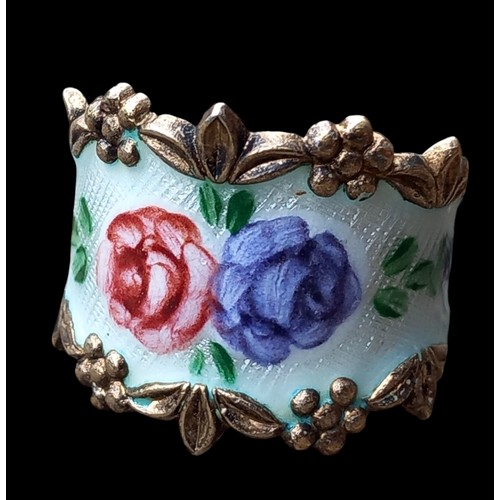 163 - A SILVER AND ENAMEL FLORAL RING