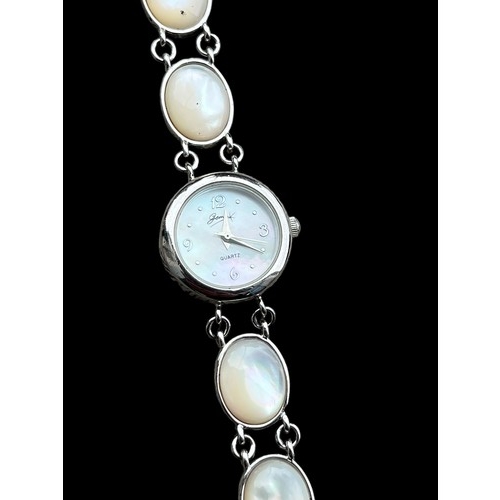 202 - A SILVER QUARTZ WATCH WITH MOTHER OF PEARL