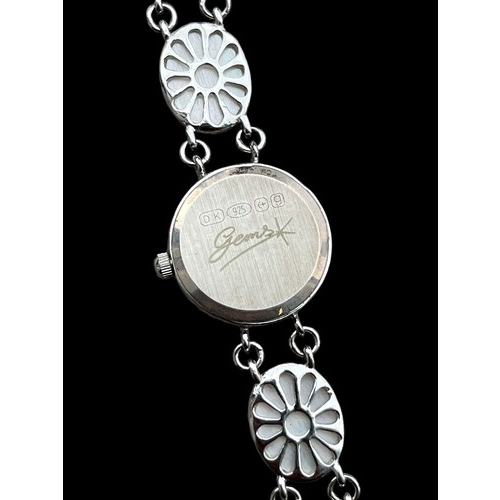 202 - A SILVER QUARTZ WATCH WITH MOTHER OF PEARL