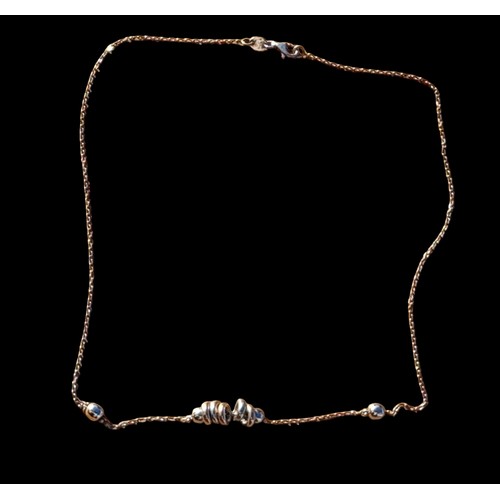 208 - A SILVER NECKLACE WITH SILVER RING PATTERN