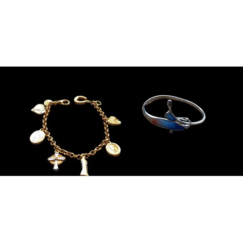 179 - AN ENAMEL BANGLE AND CHARM BRACELET