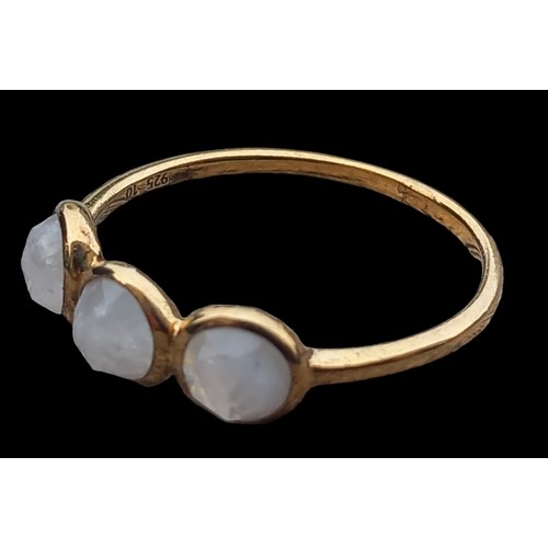 182 - A SILVER GILT MOONSTONE STYLE RING