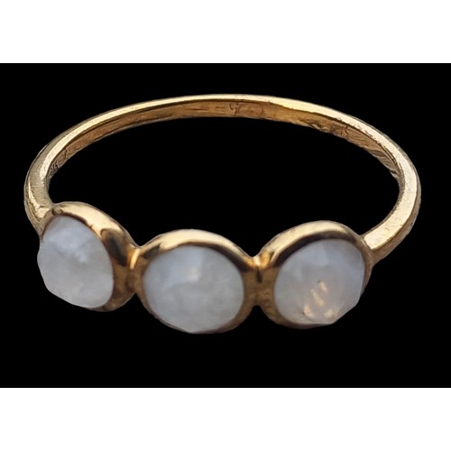 182 - A SILVER GILT MOONSTONE STYLE RING