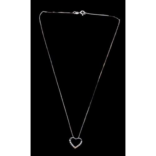 183 - A SILVER GEM SET HEART PENDANT ON A SILVER CHAIN