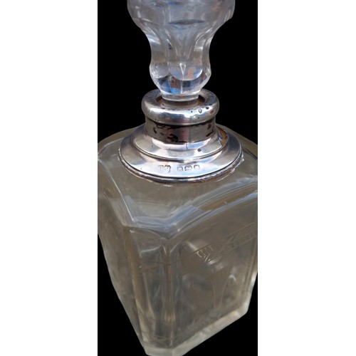 564 - AN ETCHED PERFUME BOTTLE WITH A SILVER TOP