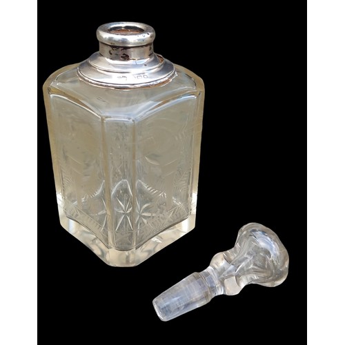 564 - AN ETCHED PERFUME BOTTLE WITH A SILVER TOP