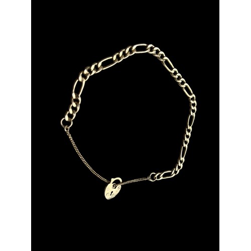 658 - A 9ct FLATLINK BRACELET WITH HEART LOCK AND SAFETY CHAIN