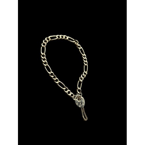 658 - A 9ct FLATLINK BRACELET WITH HEART LOCK AND SAFETY CHAIN