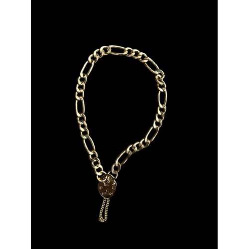 658 - A 9ct FLATLINK BRACELET WITH HEART LOCK AND SAFETY CHAIN